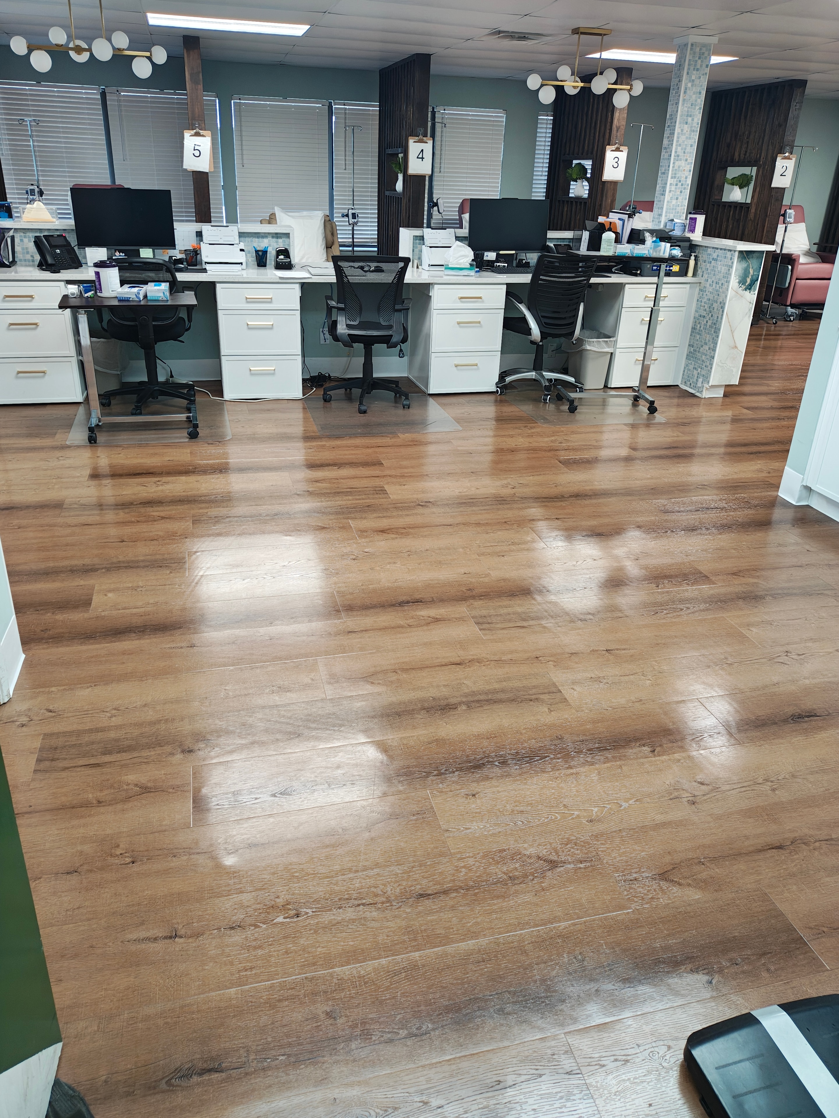 Polished wood-look office floors after cleaning